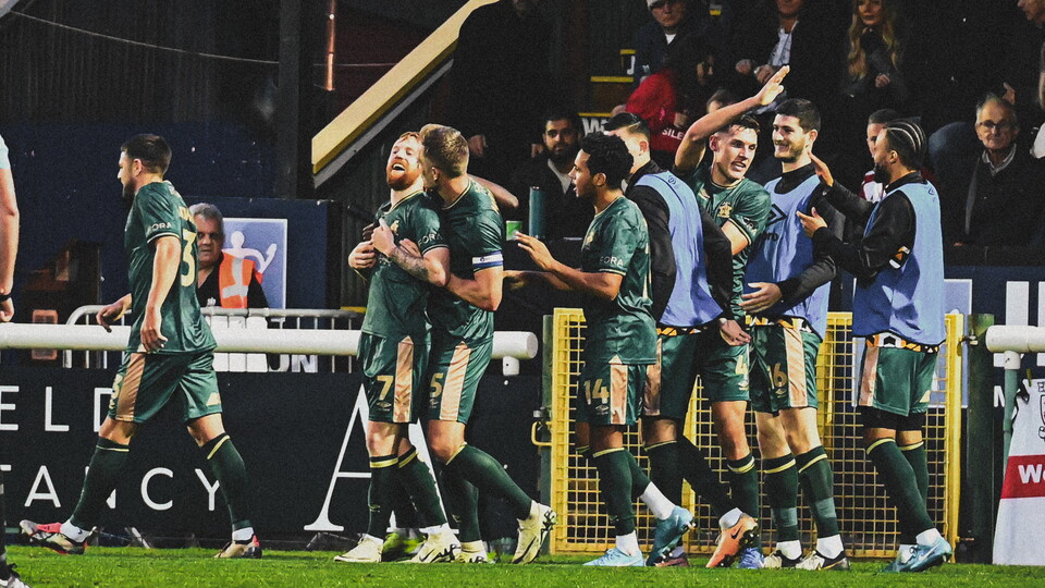 James Brophy celebrates scoring against Woking