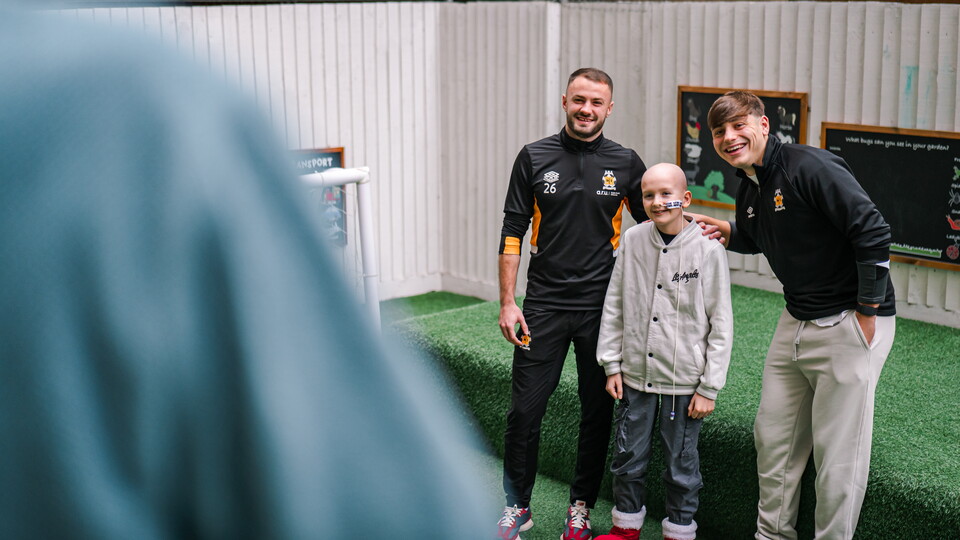 James Gibbons and Josh Stokes with a pupil from Pilgrims Pathway School