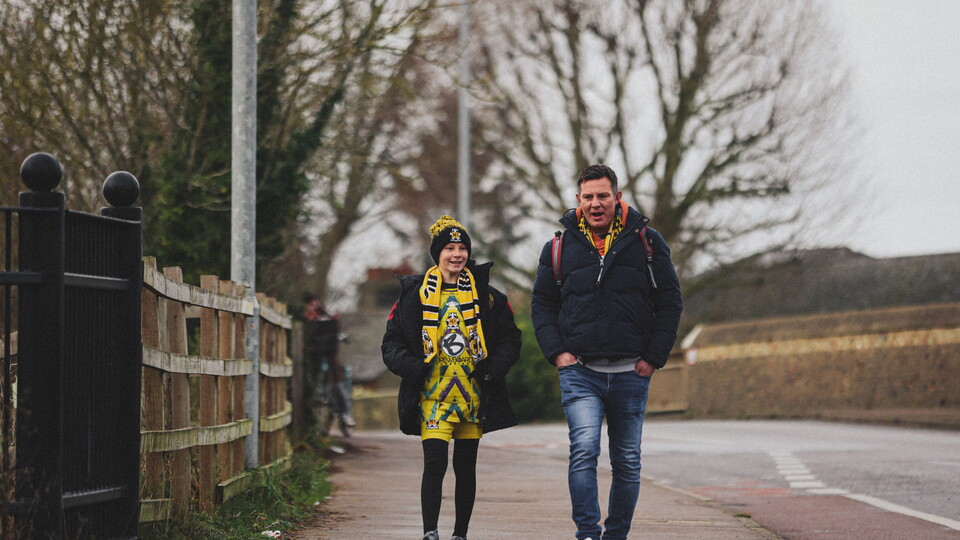 Fans walking to the Cledara Abbey Stadium