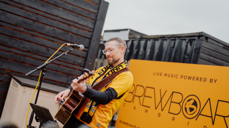 Simon Cragg performing in the Main Stand Fan Zone