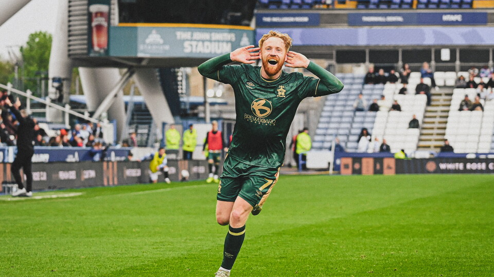 James Brophy celebrates against Huddersfield Town