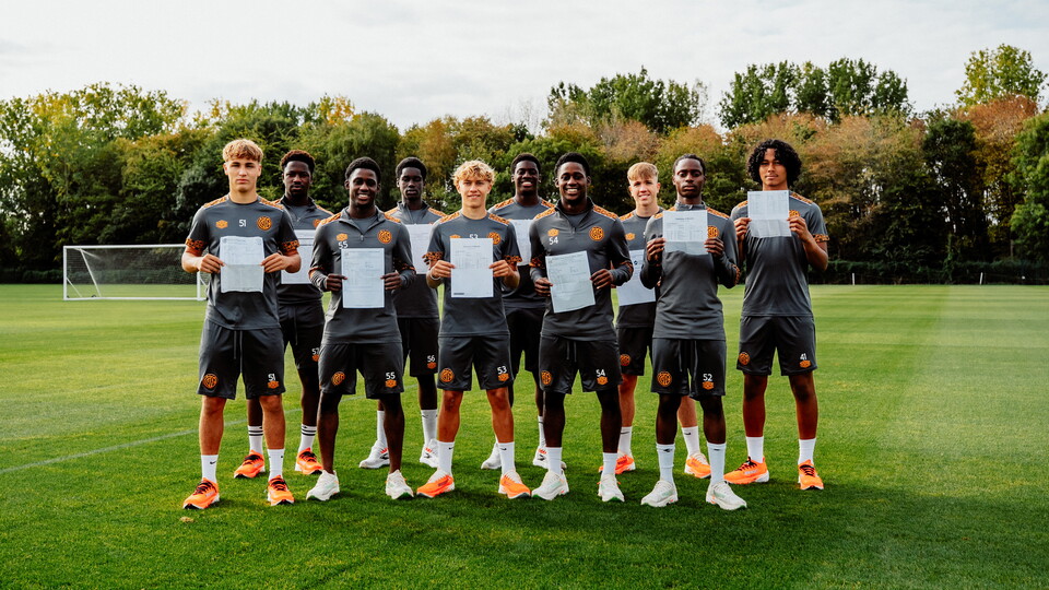 Cambridge United academy players with their exam results
