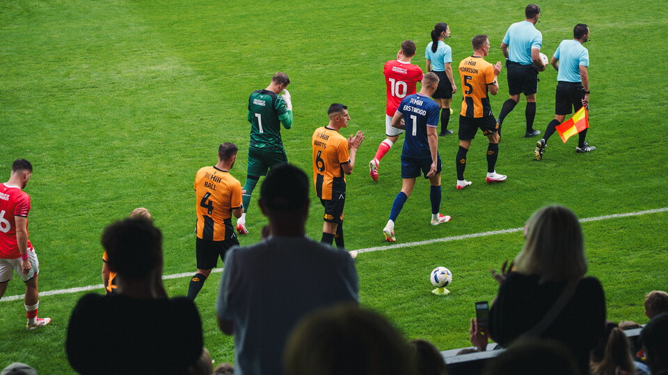 Cambridge United players walk out the tunnel