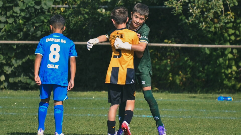 Academy players celebrate