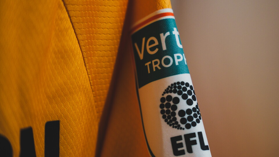 A close up of the Vertu Trophy patch on a shirt