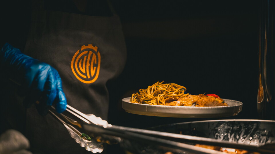 A chef cooking in Hospitality