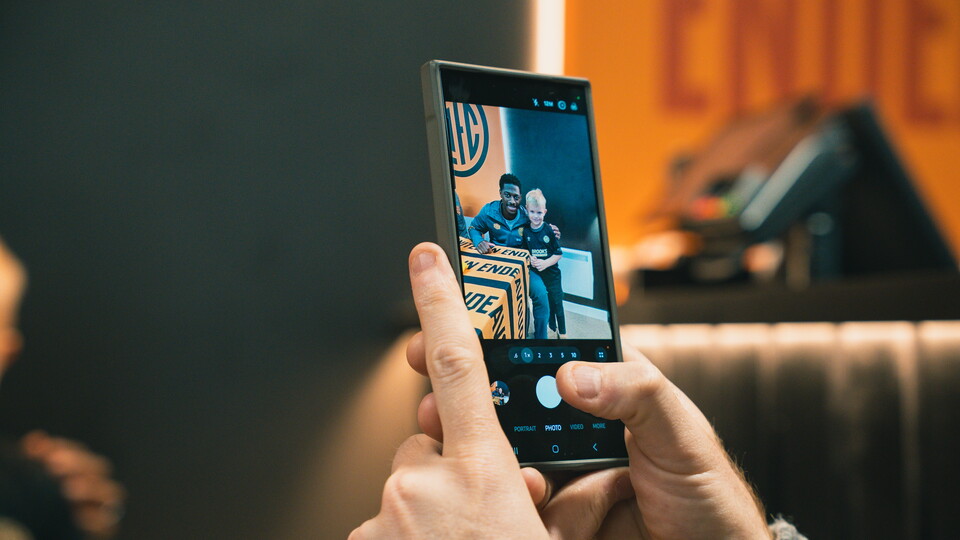 Fan takes a photo of Sullay Kaikai