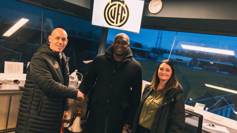 Emile Heskey with Cambridge United staff