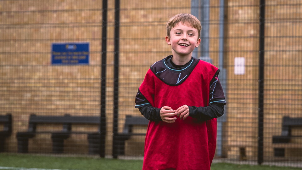 A young kid at a Soccer School