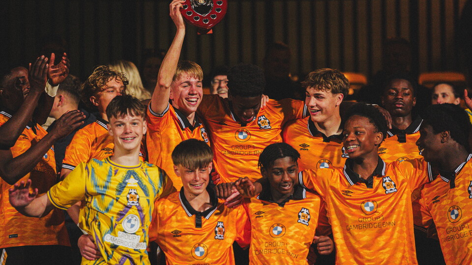 Academy players celebrate