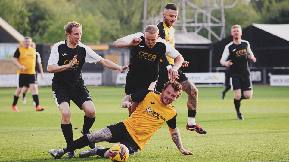 Fans play on the pitch