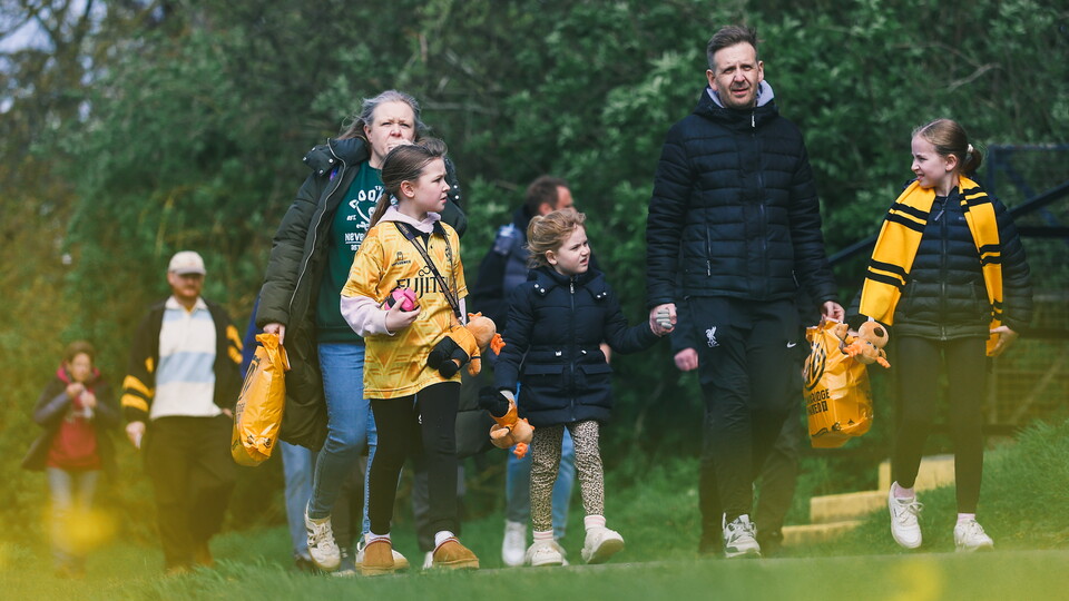 Fans walking to the Cledara Abbey Stadium