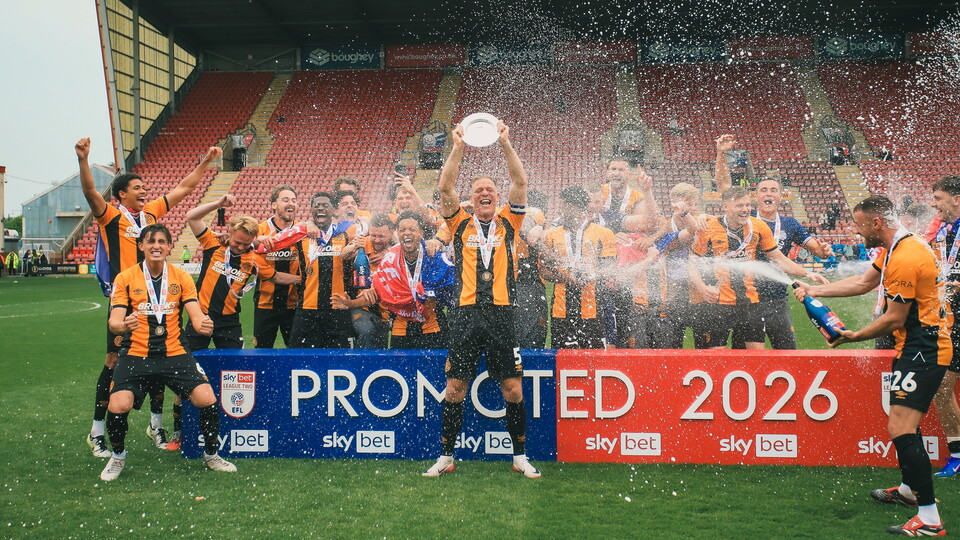 Cambridge United players celebrate promotion 