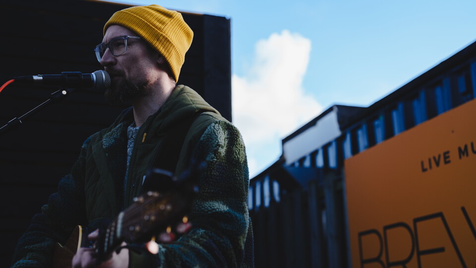 Simon Cragg plays in the Main Stand Fan Zone
