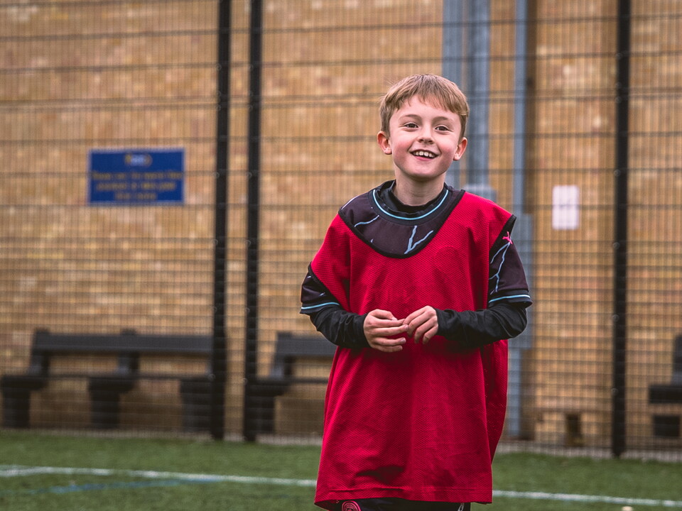 A young kid at a Soccer School