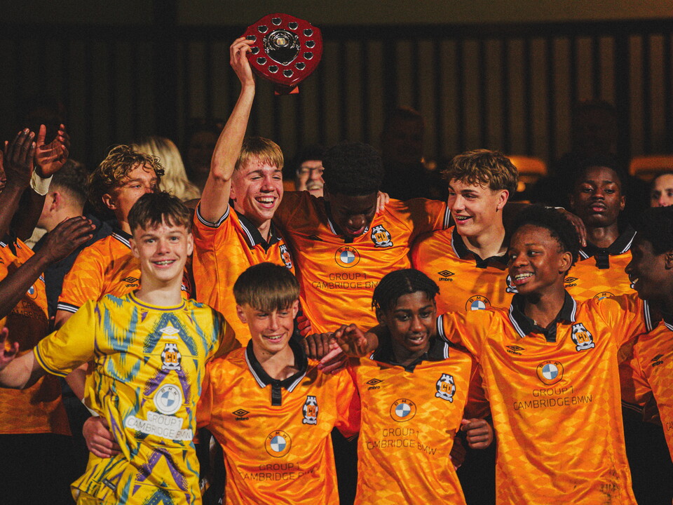Academy players celebrate