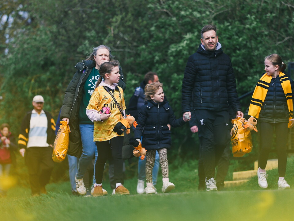 Fans walking to the Cledara Abbey Stadium