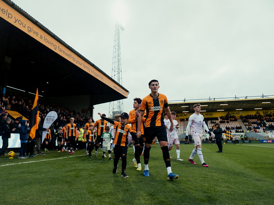 A mascot with Kell Watts